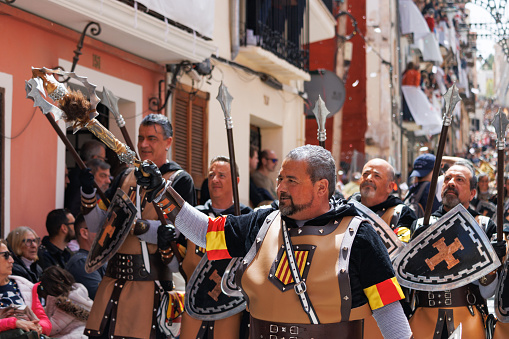 Alcoy, Spain, 04-20-2024: Squadron of the Aragoneses troupe with its corporal in front in the Moors and Christians parade of Alcoy, a festival of international tourist interest since 1980