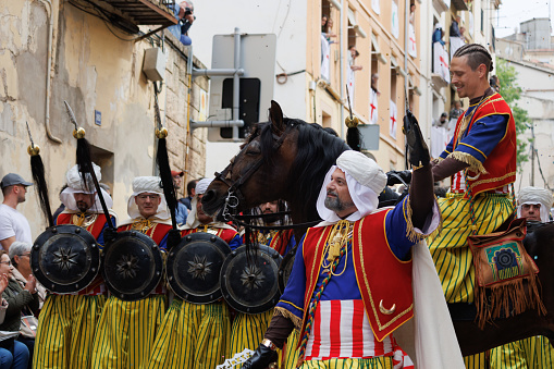 04-20-2024, Alcoy, Spain: Squadron of the Mudejar group parading through the streets of Alcoy. Popular festivals declared of international tourist interest since 1980