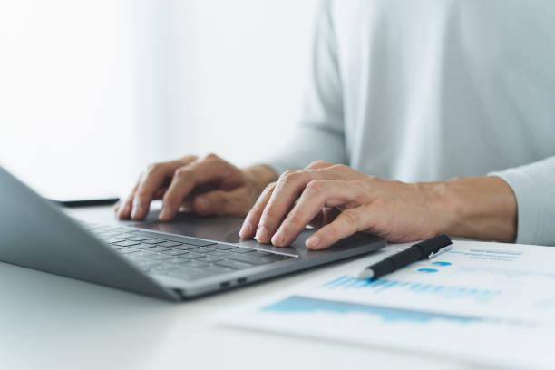 istock Businessperson working on laptop or computer with document. Businessman or analyst work with business marketing data and information. Financial analysis budget planner for management project. 2149615623