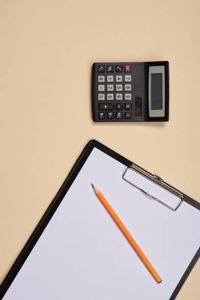 istock Notepad with pen stationery accessories beige background 2149616379