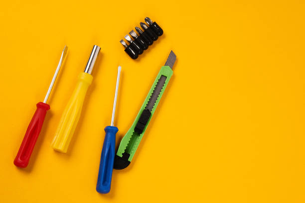 istock screwdrivers and construction tools on yellow background equipment for repair industry 2149616540