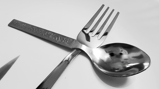 Fork and spoon in dinner plate