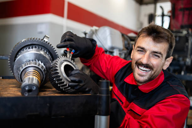istock Experienced mechanic or serviceman holding gears parts inside workshop. 2149616685