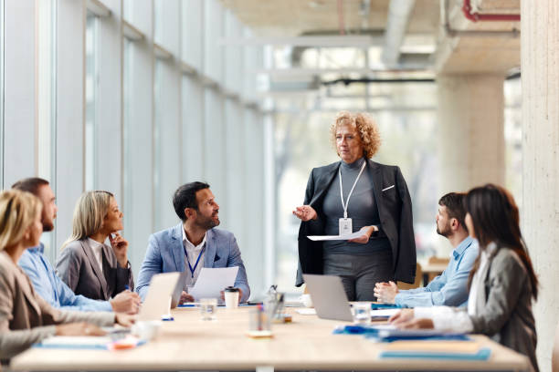 istock Mature CEO talking to her team about plans in the office. 2149616701