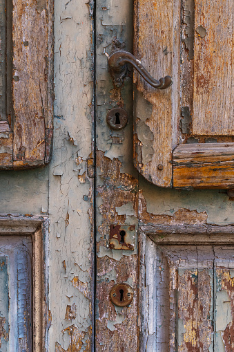 Detail of ancient door with iron handle and locks