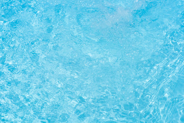 istock Bluewater waves on the surface ripples blurred. Defocus blurred transparent blue colored clear calm water surface texture with splash and bubbles. Water waves with shining pattern texture background. 2149616889