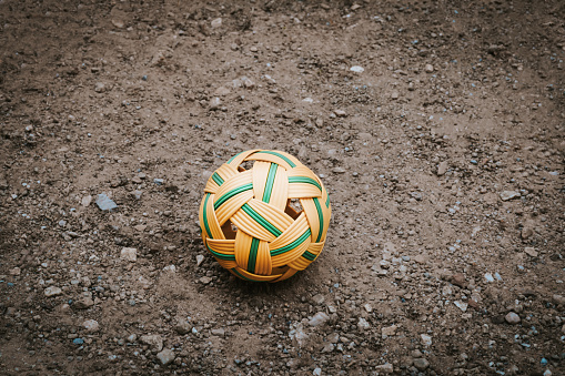 Sepak takraw balls on the black ground