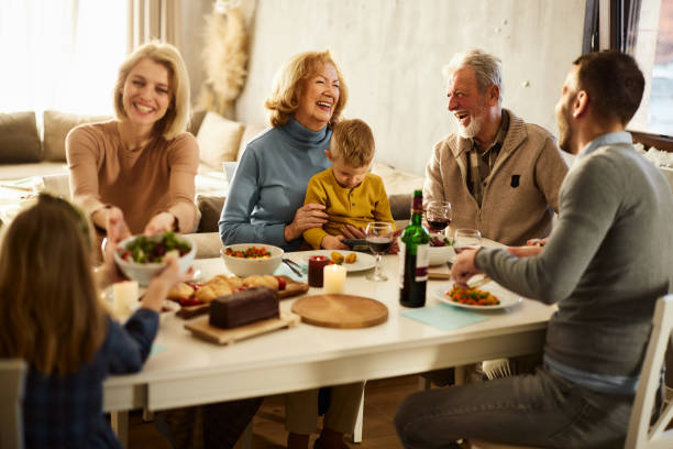istock Cheerful extended family talking during lunch at dining table. 2149617647