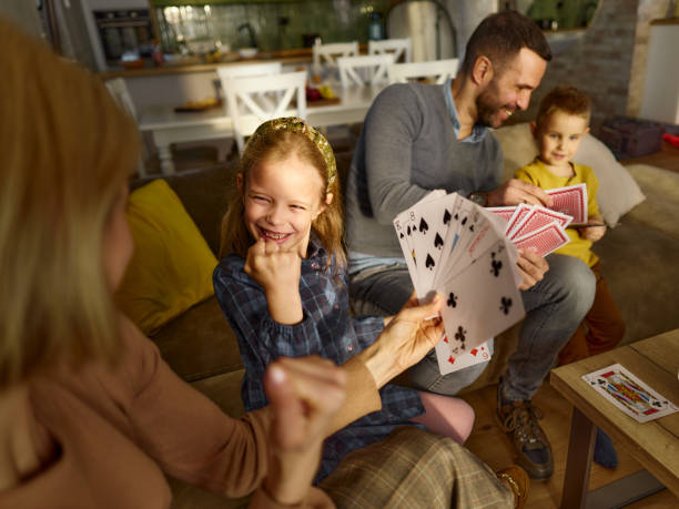 istock Yes mommy, we have the winning cards! 2149618155