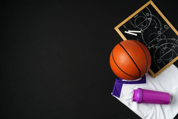 istock Basketball Strategy Planning With Chalkboard, Ball, and Jersey on Dark Background 2149620246