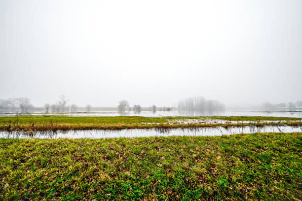 Frozen flood plane at Lower Heyford in the rural Oxfordshire countryside.