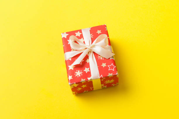 Free Stock Photo of Present Wrapped in Wrapping Paper With Red Bow ...