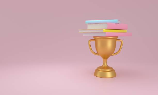istock Scholarly Success Symbolized by Books on a Trophy. 2149622705