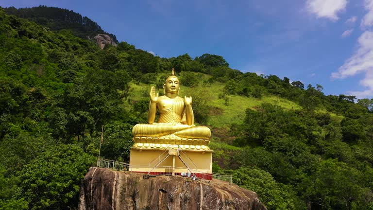 Top view of Buddhist temple with a Buddha statue in the Mountains. Sri Lanka