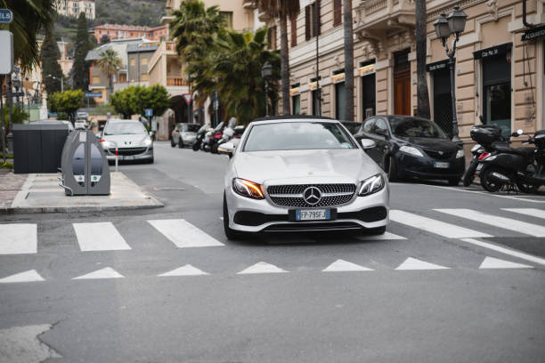 Alassio, Italy - March 30, 2024: Modern powerful beautiful car on the historical streets of a seaside town