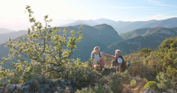 istock Mature hikers chat on hilltop 2149624050