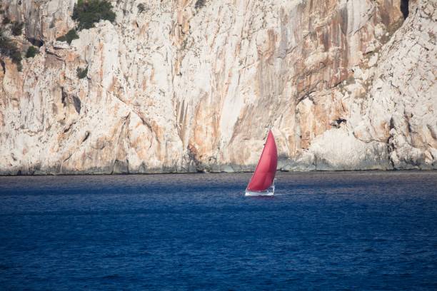 Sailing boat in race in stormy weather