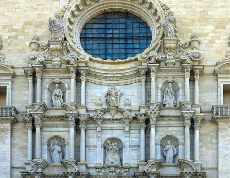 Architectural details of the medieval facade of the Saint Mary cathedral of the Gerona city, Spain
