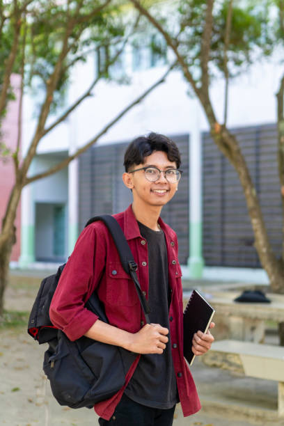 istock Asian college student at the campus park. 2149625073