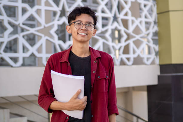 istock Asian college student smiling and looking. 2149625861