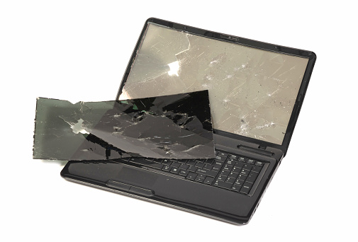 Old broken laptop isolated on white a background