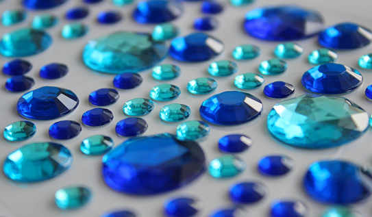 Pattern Of Scattered Variety Round Blue Glass Strasses With Faceted Edges Detailed Stock Photo