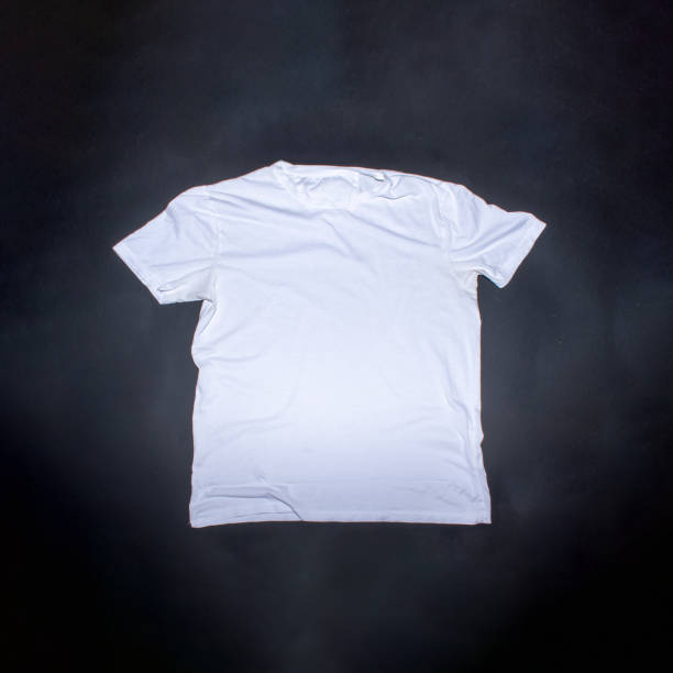 istock White t shirt on black background with place for text. Creative flat lay concept. 2149626071