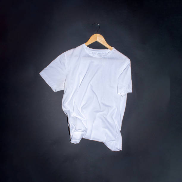 istock White t shirt on black background with place for text. Creative flat lay concept. 2149626074