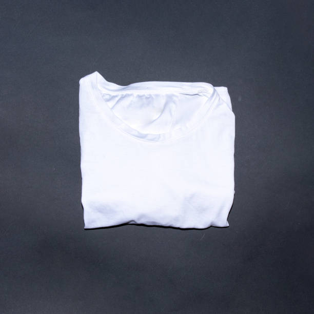 istock White t shirt on black background with place for text. Creative flat lay concept. 2149626079