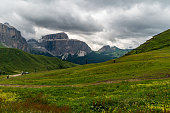 Dolomites mountains in Italy - Sella mountain ridge from meadows above Sella pass