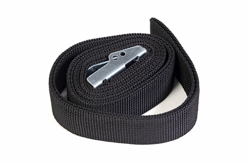 Black ratchet strap isolated on a white background