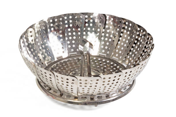istock Old kitchen tool for boiling vegetables, place it in a pan with little water 2149626441