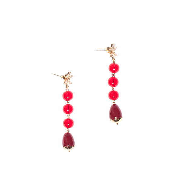 istock Gold earring with red garnet stones isolated on white background 2149626594