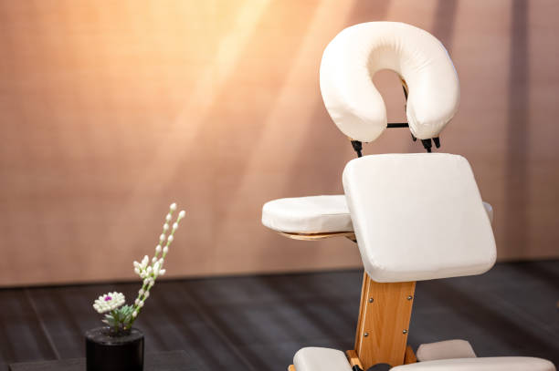 istock Portable adjustable massage chair in a cozy spa 2149628209