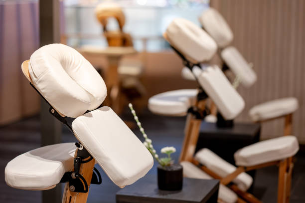 Portable adjustable massage chair in a cozy spa