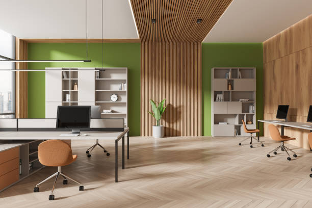 istock Stylish business interior with pc monitors on table, shelf with panoramic window 2149628996