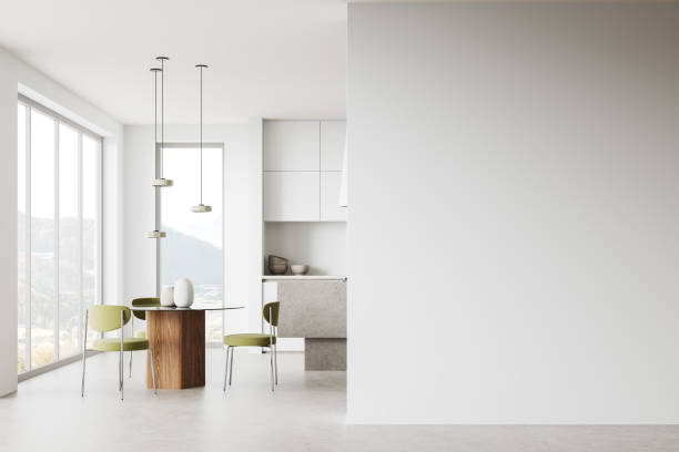 istock White home kitchen interior with eating and cooking space, window. Mock up wall 2149629110