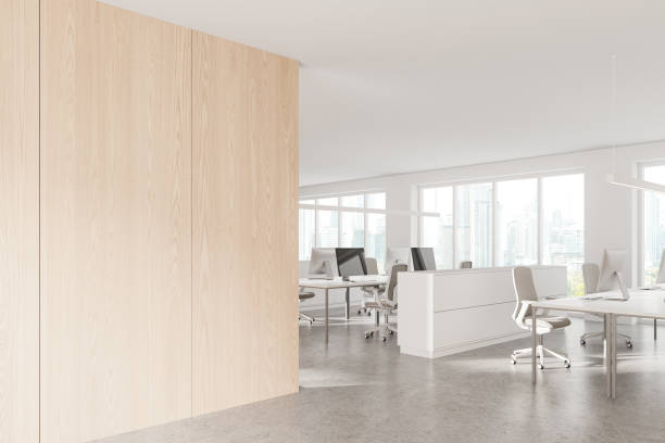 istock White and wooden open space office corner with blank wall 2149629146
