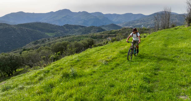 istock Aerial view of man e-biking in lush meadow 2149629163