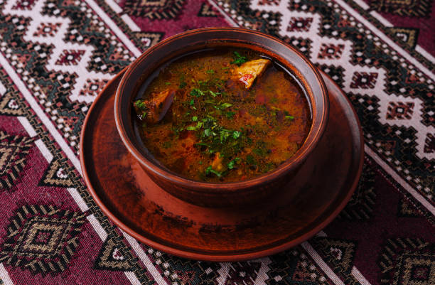 istock Traditional spicy soup in clay bowl on ethnic textile 2149629876
