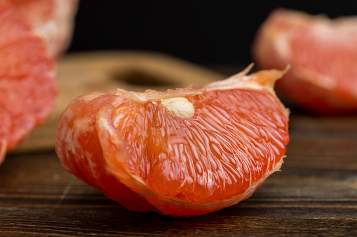 Juicy red grapefruit on the table, cooking with grapefruit