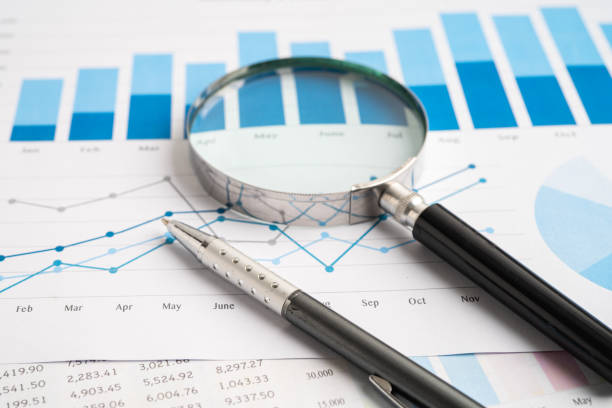istock Magnifying glass on spreadsheet and graph paper. Financial development, Banking Account, Statistic, Investment Analytic research data economy, Business. 2149631071