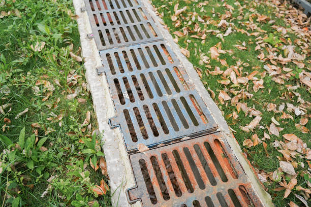 istock drainage systems. metal structures for water drainage. sewerage grate on the ground. 2149631639