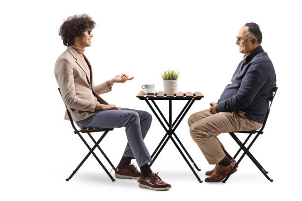 istock Young man sitting in a cafe and talking to a mature man 2149632343