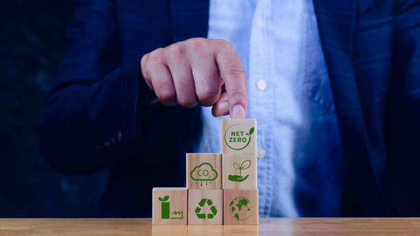 istock Net Zero and Carbon Neutral Concepts, Net zero greenhouse gas emissions target, Climate neutral long strategy. Wooden cubes with NetZero icon. 2149633102
