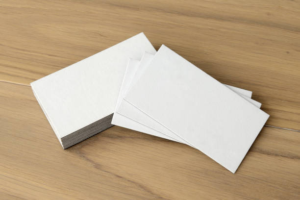 istock White business card on wood table background 2149634057