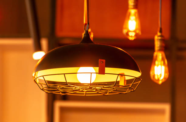 istock Decorative light bulbs hang on the bar in a cafe 2149634428
