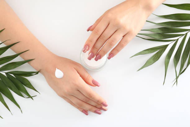 istock Concept of hand care with cosmetics on white background 2149635329