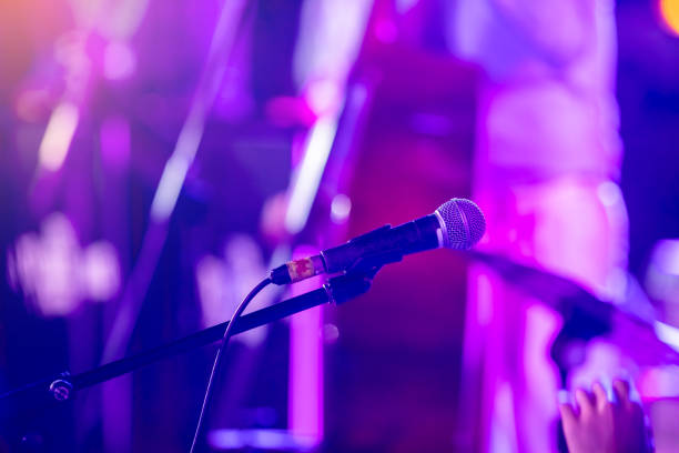 istock Selective focus to microphone with blurry music band. 2149635457