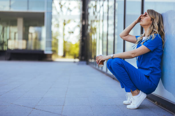 Doctor, stress and woman with depression, burnout and overworked in hospital Doctor, stress and woman with depression, burnout and overworked in hospital, deadline and tired. Healthcare, medical professional and nurse crying for mistake, depressed and fatigue with anxiety nurse smock stock pictures, royalty-free photos & images